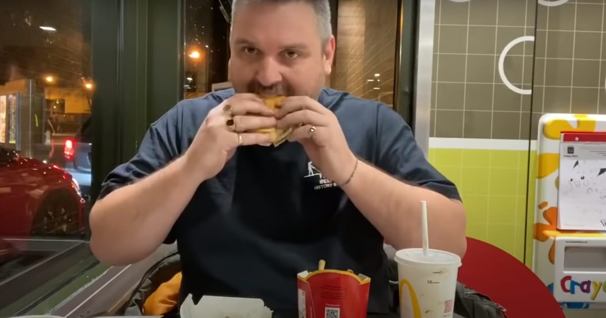Man Eating At McDonald's