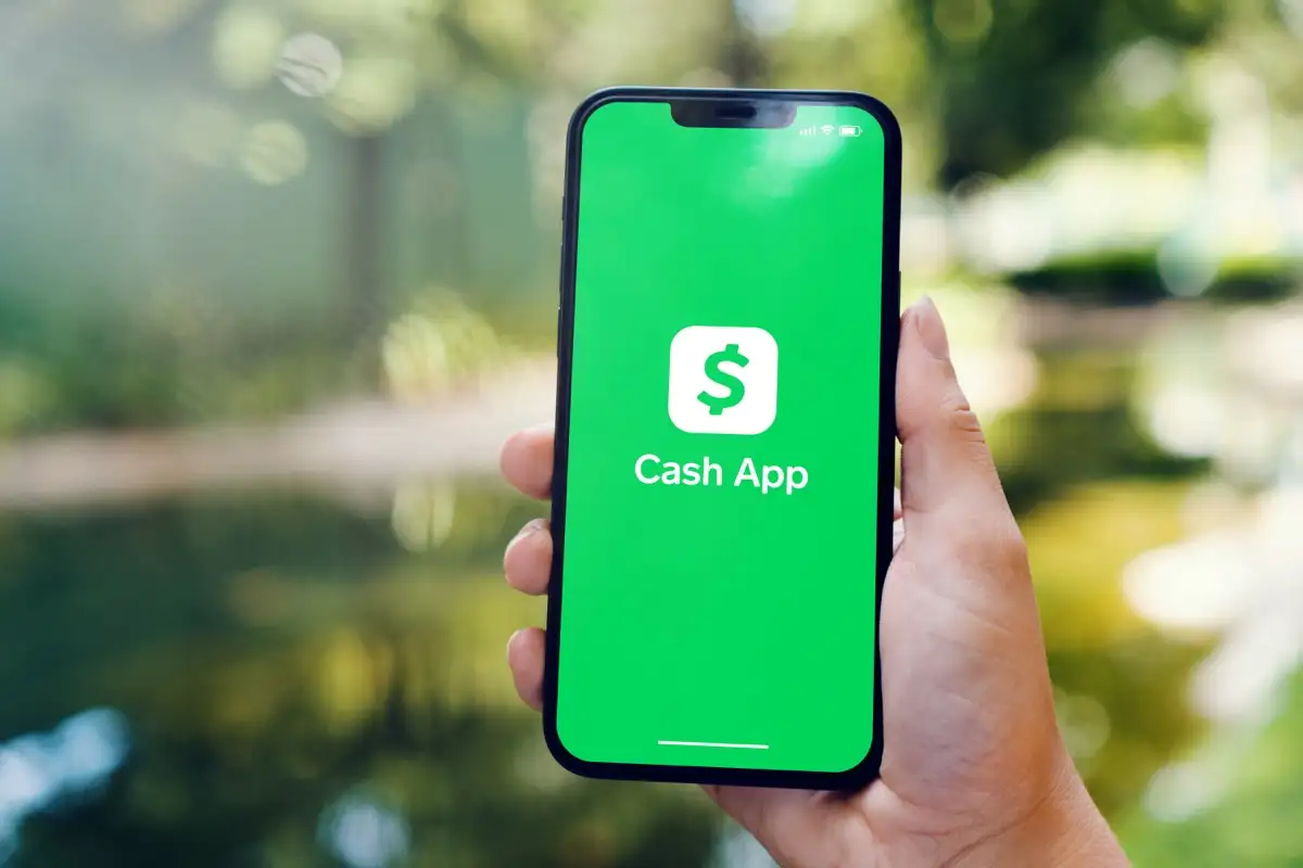 A Person Holding Phone In His Palm With Screen On Of Cash App