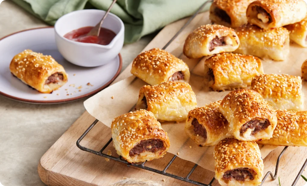 Mini sausage rolls with salsa